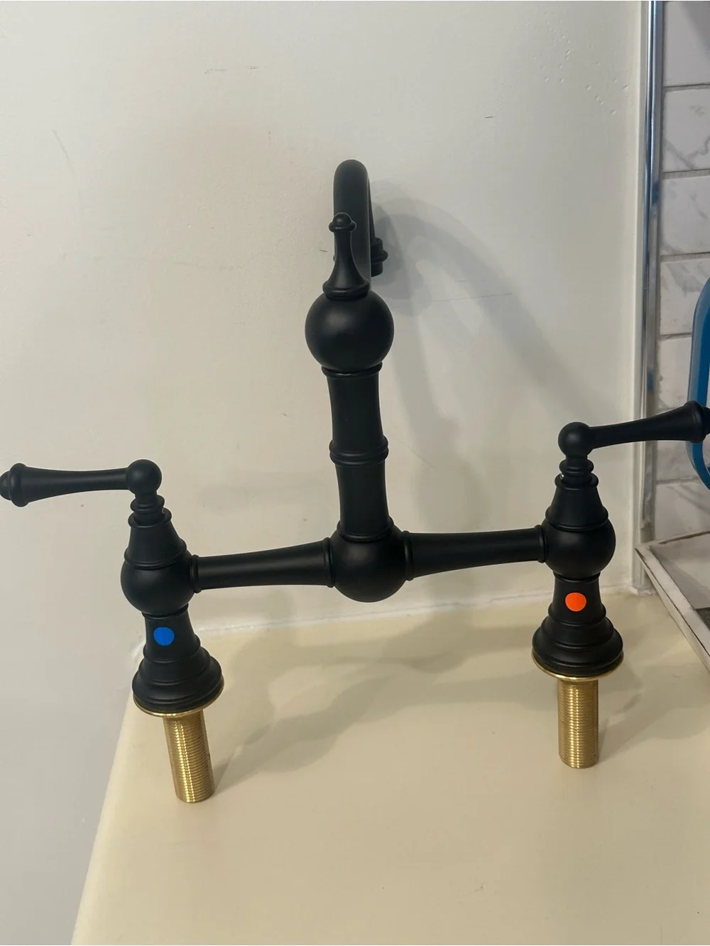 Matte Black Bridge Kitchen Faucet with Brass Accent